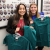 Two incoming D1 students participating holding scrubs on Welcome Day